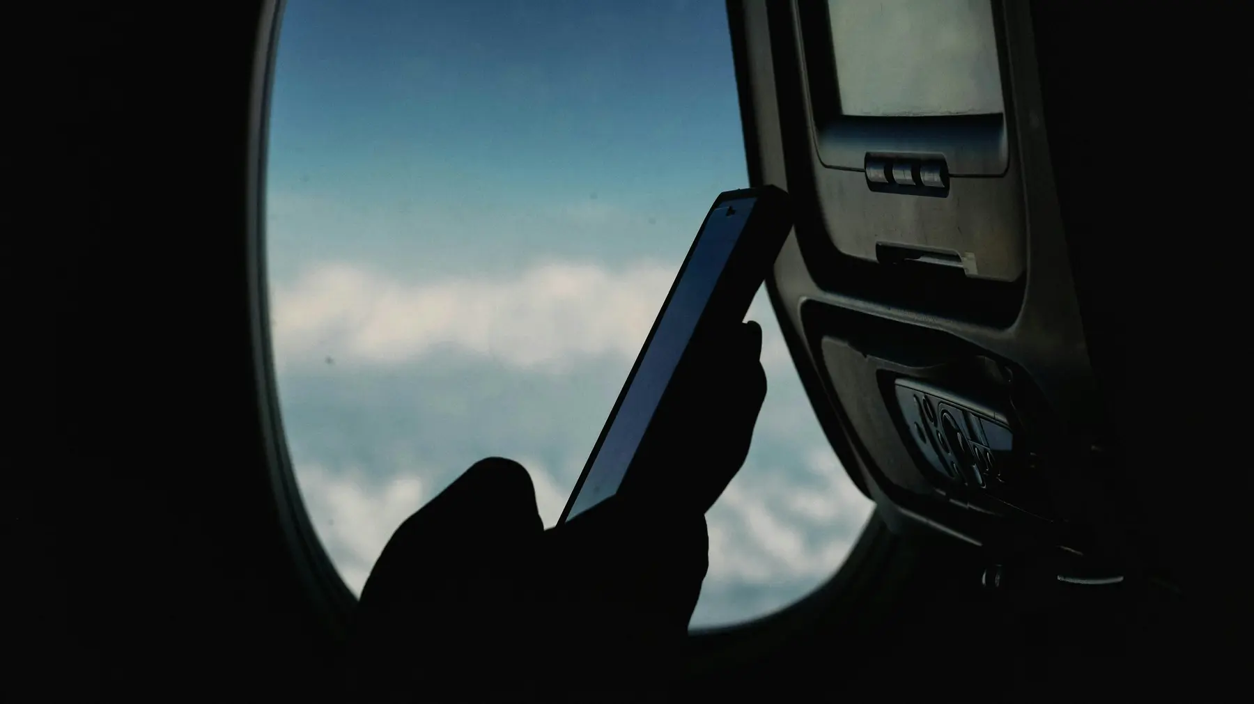 Traveler using a phone while planning an island trip