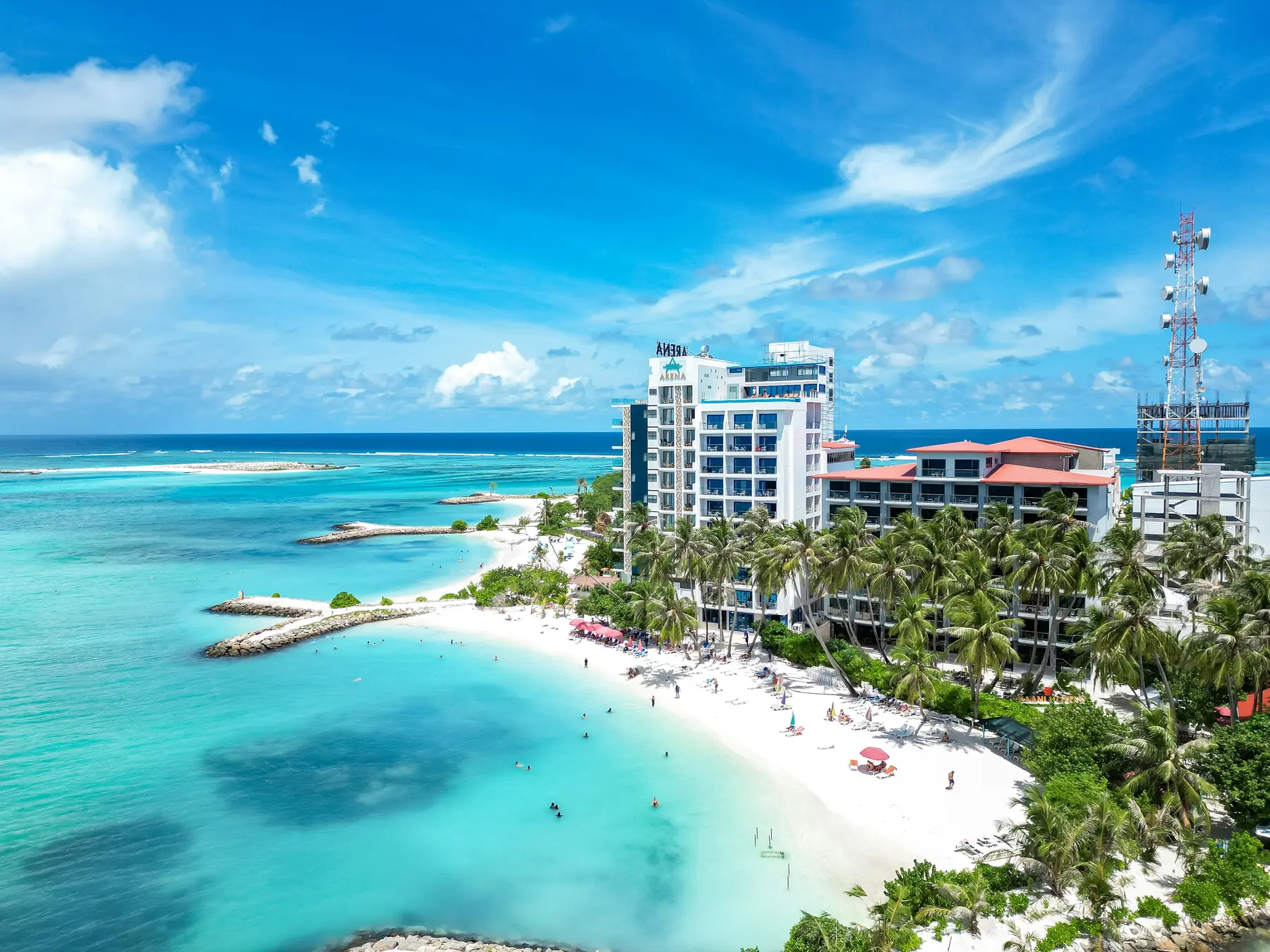 Aerial view of Maafushi local island, beach, hotels and lagoon
