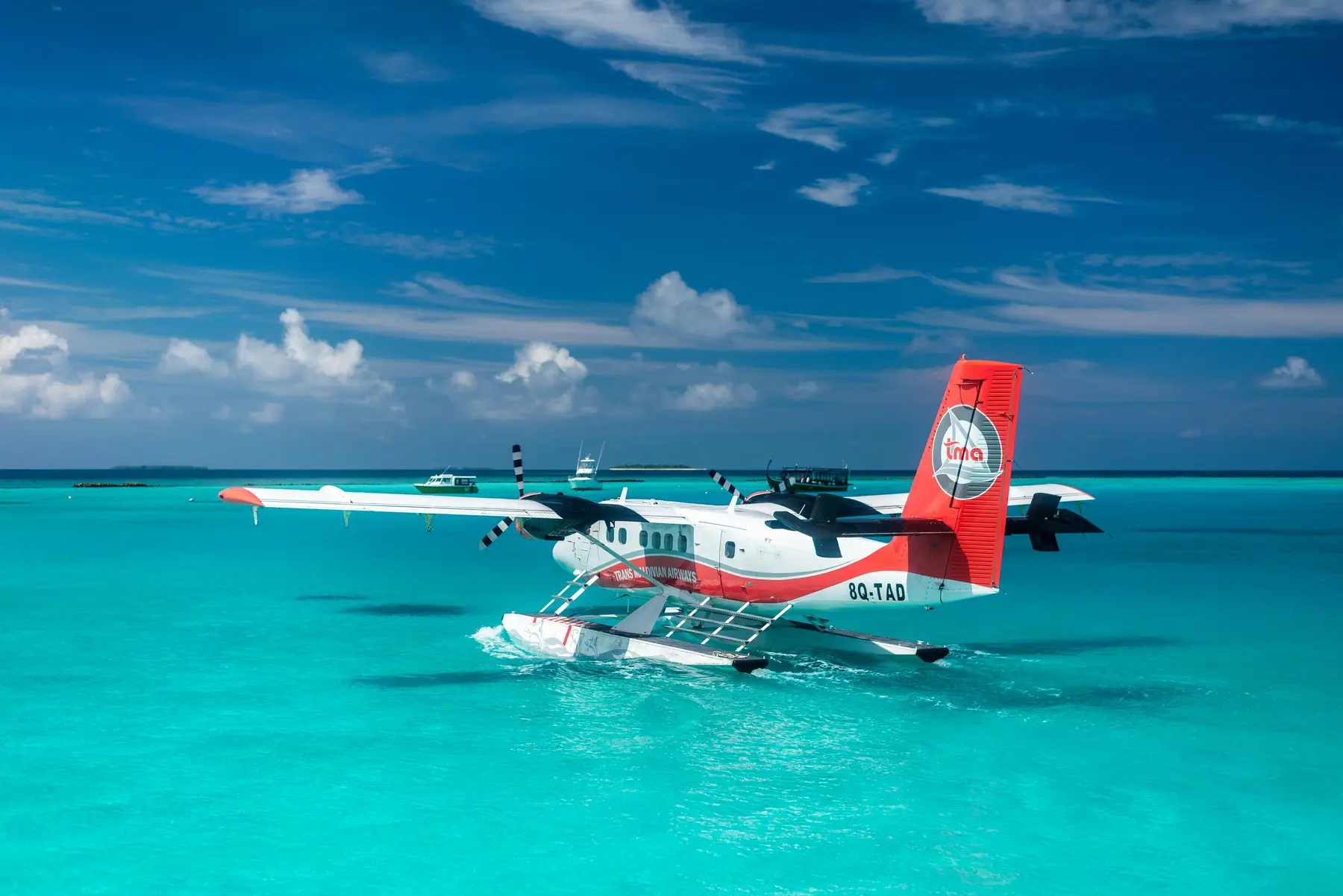 Seaplane landing on the water in the Maldives